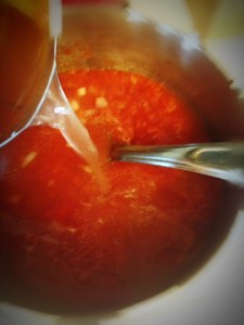 Add 1 can of water to crushed tomatoes,onion and garlic.